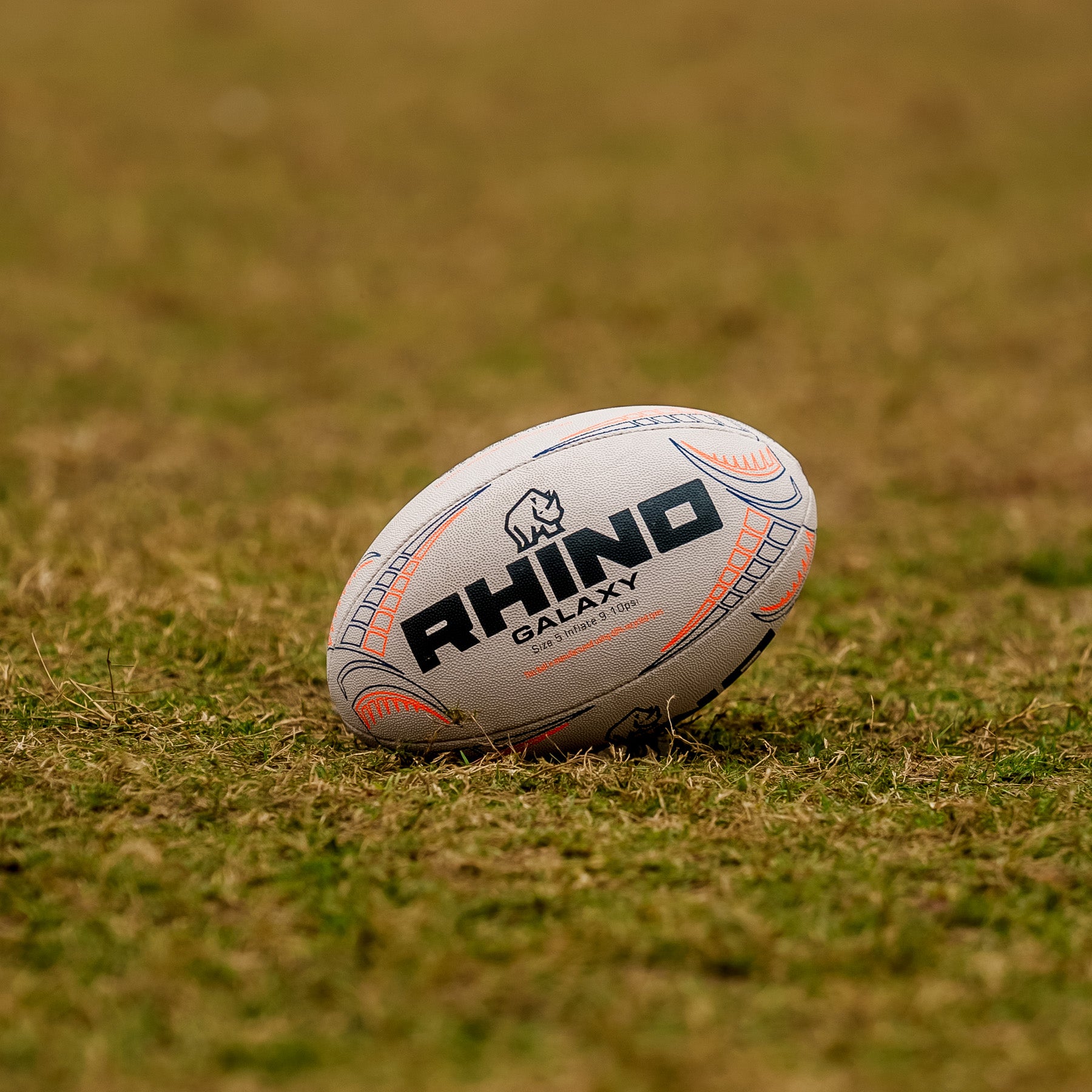 Rhino Galaxy rugby ball on a grass field