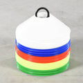 Stack of colorful plastic grid marker cones with a white base on a gray background