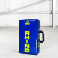 Blue and yellow Rhino rugby tackle shield on a grey floor.